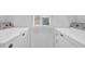 Stackable washer and dryer in a well-lit room at 612 River Oaks Dr. # 55D, Myrtle Beach, SC 29579
