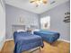 Two twin beds, a ceiling fan, and a window with a view at 612 River Oaks Dr. # 55D, Myrtle Beach, SC 29579
