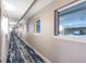 Building hallway with carpeted floor and windows at 2201 S Ocean Blvd. # 1404, Myrtle Beach, SC 29577