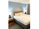 King-size bed, nightstands, and lamps in a spacious bedroom at 2201 S Ocean Blvd. # 1404, Myrtle Beach, SC 29577