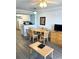 Spacious dining area with table, chairs, and views to kitchen and living room at 2201 S Ocean Blvd. # 1404, Myrtle Beach, SC 29577
