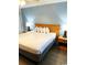 King-size bed, nightstands, and lamps in a well-lit bedroom at 2201 S Ocean Blvd. # 1404, Myrtle Beach, SC 29577