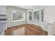 Eat-in kitchen area with bay window, wood floors, and abundant natural light at 565 Bucks Trail, Longs, SC 29568