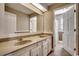 Double vanity bathroom with beige countertops and updated flooring at 3701 South Green Sea Rd., Loris, SC 29569