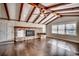 Living room with hardwood floors, fireplace and exposed wood beams at 3701 South Green Sea Rd., Loris, SC 29569