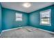 Bedroom with teal walls and carpeted floor at 3701 South Green Sea Rd., Loris, SC 29569