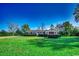 Brick ranch house with large green lawn and mature trees at 3701 South Green Sea Rd., Loris, SC 29569