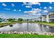 Serene community pond with surrounding homes and landscaping at 2226 Huntington Dr. # D, Surfside Beach, SC 29575