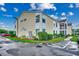 Building exterior showcasing light yellow siding and landscaping at 2226 Huntington Dr. # D, Surfside Beach, SC 29575