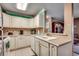 Bright kitchen boasts ample counter space, white cabinets, and a view into the living area at 2226 Huntington Dr. # D, Surfside Beach, SC 29575