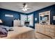 Main bedroom with a king bed, navy walls, and white dresser at 2226 Huntington Dr. # D, Surfside Beach, SC 29575