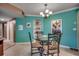 Teal dining room with glass table and four chairs at 2226 Huntington Dr. # D, Surfside Beach, SC 29575