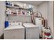 Laundry room with washer, dryer, and shelving for storage at 2226 Huntington Dr. # D, Surfside Beach, SC 29575