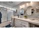 Bathroom with a shower, double vanity, and white cabinets at 2226 Huntington Dr. # D, Surfside Beach, SC 29575