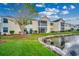 Building exterior with pond and landscaping at 2226 Huntington Dr. # D, Surfside Beach, SC 29575