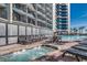 Hot tub area with lounge chairs next to the pool at 7100 Ocean Blvd. N # 825, Myrtle Beach, SC 29572