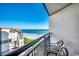 Balcony view of the ocean with two chairs at 7100 Ocean Blvd. N # 825, Myrtle Beach, SC 29572