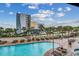Resort-style pool with plenty of lounge chairs at 7100 Ocean Blvd. N # 825, Myrtle Beach, SC 29572
