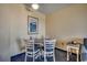 Small dining area with round table and four chairs at 7100 Ocean Blvd. N # 825, Myrtle Beach, SC 29572