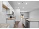 Modern kitchen with white cabinets, granite countertops and stainless steel appliances at 420 Ribbon Rail Way, Loris, SC 29569