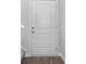 White front door with two panels and brushed nickel hardware at 420 Ribbon Rail Way, Loris, SC 29569