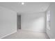 Spacious bedroom with neutral walls and carpet, plus window and access to hallway at 420 Ribbon Rail Way, Loris, SC 29569