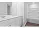 Bright bathroom features a vanity with sink and a shower bathtub combo at 420 Ribbon Rail Way, Loris, SC 29569