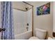Bathroom with tub shower combination and blue accents at 713 Shell Point Ct., Longs, SC 29568