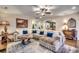 Spacious living room featuring a large sectional sofa and a stunning wood coffee table at 713 Shell Point Ct., Longs, SC 29568