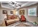 Relaxing sitting room featuring a comfortable couch and two armchairs at 713 Shell Point Ct., Longs, SC 29568