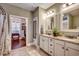 Elegant bathroom with double vanity, granite countertops, and a walk-in shower at 713 Shell Point Ct., Longs, SC 29568
