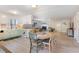 Open concept kitchen and dining area with light cabinets and a round table at 128 Beaver Pond Loop # 49, Pawleys Island, SC 29585