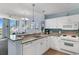 Kitchen with granite countertops, white cabinets, and stainless steel appliances at 300 N Ocean Blvd. # 128, North Myrtle Beach, SC 29582