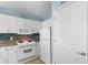 White kitchen with granite countertops and stainless steel appliances at 300 N Ocean Blvd. # 128, North Myrtle Beach, SC 29582