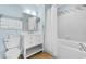 Clean bathroom with white vanity, bathtub, and shower at 300 N Ocean Blvd. # 128, North Myrtle Beach, SC 29582