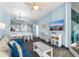 Living room featuring a blue sofa, white coffee table, and ocean view at 300 N Ocean Blvd. # 128, North Myrtle Beach, SC 29582