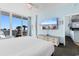 Bedroom with king-size bed, balcony access, and ocean view at 300 N Ocean Blvd. # 128, North Myrtle Beach, SC 29582