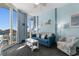 Beachfront living room with ocean views and comfortable seating at 300 N Ocean Blvd. # 128, North Myrtle Beach, SC 29582