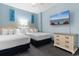 Guest bedroom with two double beds and TV at 300 N Ocean Blvd. # 128, North Myrtle Beach, SC 29582