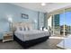 Bright bedroom with king-size bed and ocean view at 300 N Ocean Blvd. # 128, North Myrtle Beach, SC 29582