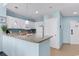 Small condo kitchen with granite countertop and white cabinets at 300 N Ocean Blvd. # 128, North Myrtle Beach, SC 29582