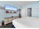 King bedroom with large TV and access to hallway at 300 N Ocean Blvd. # 128, North Myrtle Beach, SC 29582