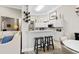 Modern kitchen with white cabinets, stainless steel appliances, and breakfast bar at 4491 Horseshoe Bend, Murrells Inlet, SC 29576