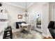 Charming dining area with round table, four chairs, and access to patio at 4491 Horseshoe Bend, Murrells Inlet, SC 29576