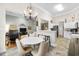 Bright dining area with a round table and chairs, open to the kitchen at 4491 Horseshoe Bend, Murrells Inlet, SC 29576