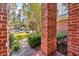 Landscaped front yard view through brick columns at 4491 Horseshoe Bend, Murrells Inlet, SC 29576
