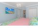 King-size bed and TV in a bright bedroom at 6001 - 8016 S Kings Hwy., Myrtle Beach, SC 29575
