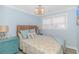 Bedroom with a queen bed and teal dresser at 6001 - 8016 S Kings Hwy., Myrtle Beach, SC 29575