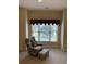 Relaxing bedroom with comfy chair and ottoman overlooking pool at 4893 Magnolia Pointe Ln. # 305, Myrtle Beach, SC 29577