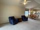 Open living room with comfy seating and adjacent dining area at 4893 Magnolia Pointe Ln. # 305, Myrtle Beach, SC 29577